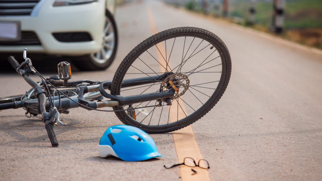 Car and bicycle accident scene illustrating Kansas bike laws.